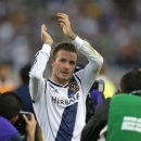 FILE - In this Saturday, Dec. 1, 2012 file photo Los Angeles Galaxy's David Beckham, of England, acknowledges the fans as he leaves the field after the team's 3-1 win in the MLS Cup championship soccer match against the Houston Dynamo in Carson, Calif.  According to reports Thursday Jan. 31, 2013, David Beckham is to join Paris Saint-Germain.  (AP Photo/Jae C. Hong, File)