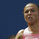 Sara Errani, of Italy, returns a shot to Flavia Pennetta, of Italy, during the second round of the 2013 U.S. Open tennis tournament, Thursday, Aug. 29, 2013, in New York. (AP Photo/Kathy Willens)