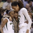 FILE - In this Dec. 18, 2012, file photo, Baylor head coach Kim Mulkey, center, hugs Brittney Griner (42) and Odyssey Sims (0) after the players were pulled late in the second half of their NCAA college basketball game against Tennessee in Waco, Texas. Baylor was announced Monday, March 18, 2013, to join Connecticut, Stanford and Notre Dame as a No. 1 seed in the women's tournament, marking the second straight season those four schools were the top seeds. (AP Photo/LM Otero, File)