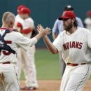 Cleveland Indians relief pitcher Chris Perez, right, and catcher Luke Carlin celebrate their 8-5 win over the Kansas City Royals in a baseball game, Monday, May 28, 2012, in Cleveland. (AP Photo/Mark Duncan)