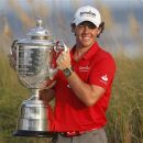 Rory McIlroy of Northern Ireland lifts the Wanamaker Trophy after capturing the PGA Championship at The Ocean Course on Kiawah Island, South Carolina, August 12, 2012. REUTERS/Mathieu Belanger