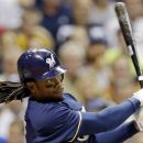 Milwaukee Brewers' Rickie Weeks hits a three-run home run during the fifth inning of a baseball game against the Atlanta Braves, Wednesday, Sept. 12, 2012, in Milwaukee. (AP Photo/Morry Gash)