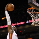 Miami Heat's LeBron James goes to the basket against the Detroit Pistons during the first half of a preseason NBA basketball game in Miami, Thursday, Oct. 18, 2012. (AP Photo/Alan Diaz)