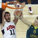 FILE - In this Aug. 8, 2012, fil ephoto, United States' Kevin Love, left, dunks as Australia's Brad Newley, right, defends during a men's quarterfinal basketball game at the 2012 Summer Olympics in London. Love is back in Minnesota after a summer highlighted by an Olympic gold medal. He's gearing up for one of the most anticipated seasons in the Timberwolves' hardscrabble history, with training camp starting next week. (AP Photo/Victor R. Caivano, File)