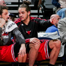 AUBURN HILLS, MI - APRIL 7: Joakim Noah #13 and Marco Belinelli #8 of the Chicago Bulls speak on the bench during a game against the Detroit Pistons on April 7, 2013 at The Palace of Auburn Hills in Auburn Hills, Michigan. (Photo by B. Sevald/Einstein/NBAE via Getty Images)