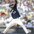 Milwaukee Brewers starting pitcher Mike Fiers throws to a Cincinnati Reds batter during the first inning of a baseball game Tuesday, Aug. 7, 2012, in Milwaukee. (AP Photo/Jeffrey Phelps)