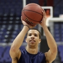 Syracuse guard Michael Carter-Williams shoots during practice for a regional semifinal game in the NCAA college basketball tournament, Wednesday, March 27, 2013, in Washington. Syracuse plays Indiana on Thursday. (AP Photo/Pablo Martinez Monsivais)