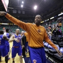 New York Knicks' Marcus Camby, right, points at a fan as he walks off the court following an NBA basketball game against the Utah Jazz Monday, March 18, 2013, in Salt Lake City. (AP Photo/Rick Bowmer)