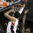 Gonzaga's Elias Harris, left, attempts a layup against Baylor's Taurean Prince during the first half of an NCAA college basketball game in Spokane, Wash., on Friday, Dec. 28, 2012. (AP Photo/Young Kwak)