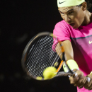Rafael Nadal of Spain, returns the ball to Thomaz Bellucci of Brazil, in their Rio Open tennis tournament match, in Rio de Janeiro, Brazil, Tuesday, Feb. 17, 2015. Top-seeded Nadal defeated Bellucci 6-4, 6-1 in his first clay-court match of the season. (AP Photo/Felipe Dana)