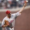 Philadelphia Phillies starting pitcher Cliff Lee throws to the San Francisco Giants during the first inning of a baseball game in San Francisco, Wednesday, April 18, 2012. (AP Photo/Marcio Jose Sanchez)