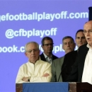 Bill Hancock, right, executive director of the Bowl Championship Series, introduces the new name - College Football Playoffs - and competition framework of what will replace the BCS in 2014 at a meeting of the football conference commissioners in Pasadena, Calif., Tuesday, April 23, 2013. He is joined onstage by, from left, commissioners Mike Slive of the Southeastern Conference, Britton Banowsky of Conference USA, Bob Bowlsby of the Big 12, and Larry Scott of the Pac-12. (AP Photo/Reed Saxon)
