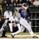 Cleveland Indians' Jason Kipnis swings through a three-run home run off Chicago White Sox starting pitcher John Danks as catcher A.J. Pierzynski watches behind the plate during the seventh inning of a baseball game, Thursday, May 3, 2012, in Chicago. (AP Photo/Charles Rex Arbogast)
