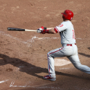 Philadelphia Phillies' Michael Young hits an RBI single off Chicago Cubs relief pitcher Kevin Gregg, scoring Roger Bernadina, in the ninth inning of a baseball game Friday, Aug. 30, 2013, in Chicago. The Phillies won 6-5. (AP Photo/Charles Rex Arbogast)