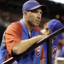 Chicago Cubs manager Dale Sveum watches from the dugout during the first inning of a baseball game against the St. Louis Cardinals Friday, Sept. 27, 2013, in St. Louis. (AP Photo/Jeff Roberson)