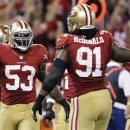 San Francisco 49ers linebacker NaVorro Bowman (53) and defensive tackle Ray McDonald (91) celebrate during the second half of an NFL football game against the Seattle Seahawks in San Francisco, Thursday, Oct. 18, 2012. (AP Photo/Ben Margot)