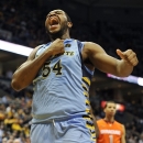 Marquette's Davante Gardner (54) celebrates a basket against Syracuse during the first half of an NCAA college basketball game, Monday, Feb. 25, 2013, in Milwaukee. (AP Photo/Jim Prisching)