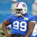 Buffalo Bills defensive tackle Marcell Dareus (99) stretches during an NFL football organized team activity in Orchard Park, N.Y., Wednesday, May 27, 2015. (AP Photo/Bill Wippert)