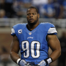 FILE - In this Sept. 8, 2013 file photo, Detroit Lions defensive tackle Ndamukong Suh (90) walks on the field before an NFL football game against the Minnesota Vikings at Ford Field in Detroit. The NFL is looking into possibly disciplining Suh for his latest on-field infraction. League spokesman Randall Liu confirmed the review on Monday, Sept. 9, 2013, in an email to The Associated Press. Suh, a defensive tackle, was called for an illegal low block against Minnesota center John Sullivan during an interception return Sunday.(AP Photo/Duane Burleson, File)