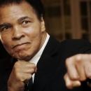 U.S. boxing great Muhammad Ali poses during the Crystal Award ceremony at the World Economic Forum (WEF) in Davos, Switzerland January 28, 2006. REUTERS/Andreas Meier/File Photo