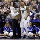 Michigan State guard Keith Appling (11) is helped off the court by trainer Quinton Sawyer in the second half of their third-round game of the NCAA college basketball tournament against Memphis in Auburn Hills, Mich., Saturday March 23, 2013. Michigan State won 70-48. (AP Photo/Paul Sancya)