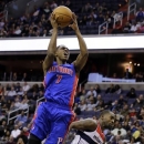 Detroit Pistons guard Brandon Knight shoots over Washington Wizards forward Martell Webster in the first half of an NBA basketball game on Wednesday, Feb. 27, 2013, in Washington. (AP Photo/Alex Brandon)