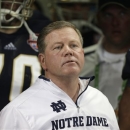 FILE - Notre Dame head coach Brian Kelly watches play against Alabama during the second half of the BCS National Championship college football game in this Jan. 7, 2013 file photo taken in Miami. The Philadelphia Eagles interviewed Notre Dame coach Brian Kelly Tuesday Jan 8, 2013 for their coaching vacancy, a person familiar with the meeting told The Associated Press. (AP Photo/Chris O'Meara)