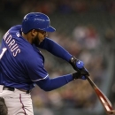 Texas Rangers' Elvis Andrus fouls off a pitch from the Seattle Mariners in the first inning of a baseball game on Saturday, April 13, 2013, in Seattle. (AP Photo/Elaine Thompson)