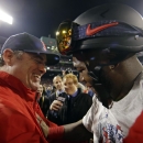 Boston Red Sox manager John Farrell and David Ortiz celebrate after Boston defeated the St. Louis Cardinals in Game 6 of baseball's World Series Wednesday, Oct. 30, 2013, in Boston. The Red Sox won 6-1 to win the series. (AP Photo/Matt Slocum)
