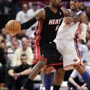 Miami Heat forward LeBron James, left, posts up on New York Knicks forward Carmelo Anthony during the first half of Game 3 of an NBA basketball first-round playoff series at Madison Square Garden in New York, Thursday, May 3, 2012. (AP Photo/Kathy Willens)