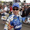 Mark Martin waves to the crowd before a NASCAR Sprint Cup Series auto race, Sunday, March 3, 2013, in Avondale, Ariz. (AP Photo/Ross D. Franklin)