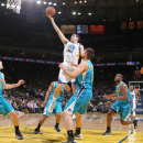 OAKLAND, CA - APRIL 3: Klay Thompson #11 of the Golden State Warriors shoots a layup against Ryan Anderson #33 and Lou Amundson #17 of the New Orleans Hornets on April 3, 2013 at Oracle Arena in Oakland, California. (Photo by Jack Arent/NBAE via Getty Images)
