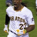 Pittsburgh Pirates center fielder Andrew McCutchen rounds the bases after hitting a solo home run off Cincinnati Reds relief pitcher Jonathan Broxton in the ninth inning of a baseball game in Pittsburgh Saturday, Sept. 29, 2012. The homer game the Pirates a 2-1 win. (AP Photo/Gene J. Puskar)