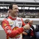 Helio Castroneves, of Brazil, jokes with members of his crew after his qualification run on the first day of qualifications for the Indianapolis 500 auto race at the Indianapolis Motor Speedway in Indianapolis, Saturday, May 18, 2013. (AP Photo/Tom Strattman)