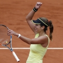 Germany's Julia Goerges celebrates her win over Denmark's Caroline Wozniacki after their second round match of the French Open tennis tournament at the Roland Garros stadium, Thursday, May 28, 2015 in Paris. Georges won 6-4, 7-6. (AP Photo/Christophe Ena)