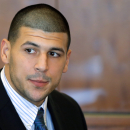 FILE - In this Oct. 9, 2013, file photo, former New England Patriots NFL football player Aaron Hernandez attends a pretrial court hearing in superior court in Fall River, Mass. Judge Susan Garsh rejected a request Friday, Feb. 7, 2014, by prosecutors in Hernandez's murder case for his jailhouse phone recordings, then ordered them to turn over to the defense copies of calls they acknowledged already having. (AP Photo/Brian Snyder, Pool, File)
