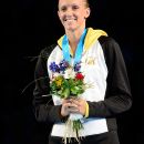 OMAHA, NE - JUNE 26:  Dana Vollmer celebrates after she received her gold medal for finishing first in the championship final heat of the Women's 100 m Butterfly during Day Two of the 2012 U.S. Olympic Swimming Team Trials at CenturyLink Center on June 26, 2012 in Omaha, Nebraska.  (Photo by Jamie Squire/Getty Images)