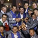 Team Europe golfers (front row L-R) Nicolas Colsaerts, Sergio Garcia, and Graeme McDowell and (back row L-R) Ian Poulter, Paul Lawrie, Francesco Molinari, Lee Westwood, captain Jose Maria Olazabal, Justin Rose, Luke Donald , Peter Hanson, Rory McIlroy and Martin Kaymer pose with the Ryder Cup after the closing ceremony of the 39th Ryder Cup at the Medinah Country Club in Medinah, Illinois, September 30, 2012. REUTERS/Jeff Haynes