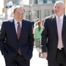 NHL commissioner Gary Bettman, left, and deputy commisioner and chief legal officer Bill Daly, Deputy Commissioner leave the NHLPA offices in Toronto on Wednesday, Aug. 22, 2012. Negotiations continue between the NHL and the NHLPA over collective bargaining as both sides try to avoid a potential lockout. (AP Photo/The Canadian Press, Chris Young)