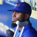 Toronto Blue Jays Jose Reyes, who twisted his left ankle during a Friday game, watches from the dugout during the second inning of a baseball game against the Kansas City Royals at Kauffman Stadium in Kansas City, Mo., Saturday, April 13, 2013. The Blue Jays placed Reyes on the 15-day disabled list with a sprained ankle and selected the contract of shortstop Munenori Kawasaki from Triple-A Buffalo. (AP Photo/Orlin Wagner)