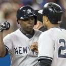 New York Yankees' Alfonso Soriano, left, is congratulated by Robinson Cano after hitting a three-run home during against the Toronto Blue Jays during the first inning of a baseball in Toronto on Tuesday, Aug. 27, 2013. (AP Photo/The Canadian Press, Frank Gunn)