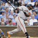 National League's Pablo Sandoval, of the San Francisco Giants, hits a three-run triple during the first inning of the MLB All-Star baseball game, Tuesday, July 10, 2012, in Kansas City, Mo. (AP Photo/Charlie Riedel)