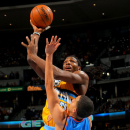DENVER, CO - JANUARY 20:  Kenneth Faried #35 of the Denver Nuggets takes a shot over Kevin Martin #23 of the Oklahoma City Thunder at the Pepsi Center on January 20, 2013 in Denver, Colorado. The Nuggets defeated the Thunder 121-118 in overtime. (Photo by Doug Pensinger/Getty Images)