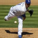 Los Angeles Dodgers starting pitcher Josh Beckett throws to the plate during the second inning of their baseball game against the Colorado Rockies, Sunday, Sept. 30, 2012, in Los Angeles. (AP Photo/Mark J. Terrill)