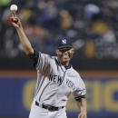 New York Yankees relief pitcher Mariano Rivera  throws out the ceremonial first pitch before the Yankees' interleague baseball against the New York Mets game at Citi Field in New York, Tuesday, May 28, 2013. (AP Photo/Kathy Willens)