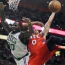 Atlanta Hawks' Jeff Teague (0) fouls Boston Celtics' Brandon Bass (30) during the first quarter of Game 4 of an NBA first-round playoff basketball series, in Boston on Sunday, May 6, 2012. (AP Photo/Michael Dwyer)
