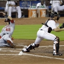 Washington Nationals' Ian Desmond slides into home plate as Miami Marlins catcher Rob Brantly waits for the throw during the first inning of a baseball game, Monday, April 15, 2013 in Miami. Desmond and Ryan Zimmerman scored on a single by Tyler Moore. (AP Photo/Wilfredo Lee)