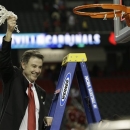 Louisville head coach Rick Pitino celebrates after the team defeated Michigan 82-76 during the NCAA Final Four tournament college basketball championship game, Monday, April 8, 2013, in Atlanta. (AP Photo/David J. Phillip)