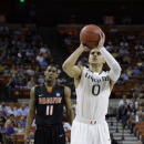 Miami's Shane Larkin (0) shoots a free throw as Pacific's Lorenzo McCloud (11) watches during the first half of a second-round game of the NCAA college basketball tournament Friday, March 22, 2013, in Austin, Texas.  (AP Photo/David J. Phillip)