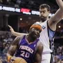Phoenix Suns' Jermaine O'Neal (20) works the ball around Memphis Grizzlies' Marc Gasol, of Spain, during the first half of an NBA basketball game in Memphis, Tenn., Tuesday, Dec. 4, 2012. (AP Photo/Danny Johnston)